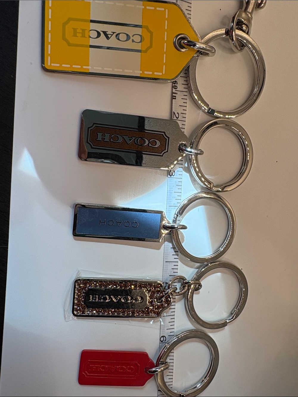 Coach Men’s Keychain Collection in Yellow, Silver, Blue, Gold-tone, Red